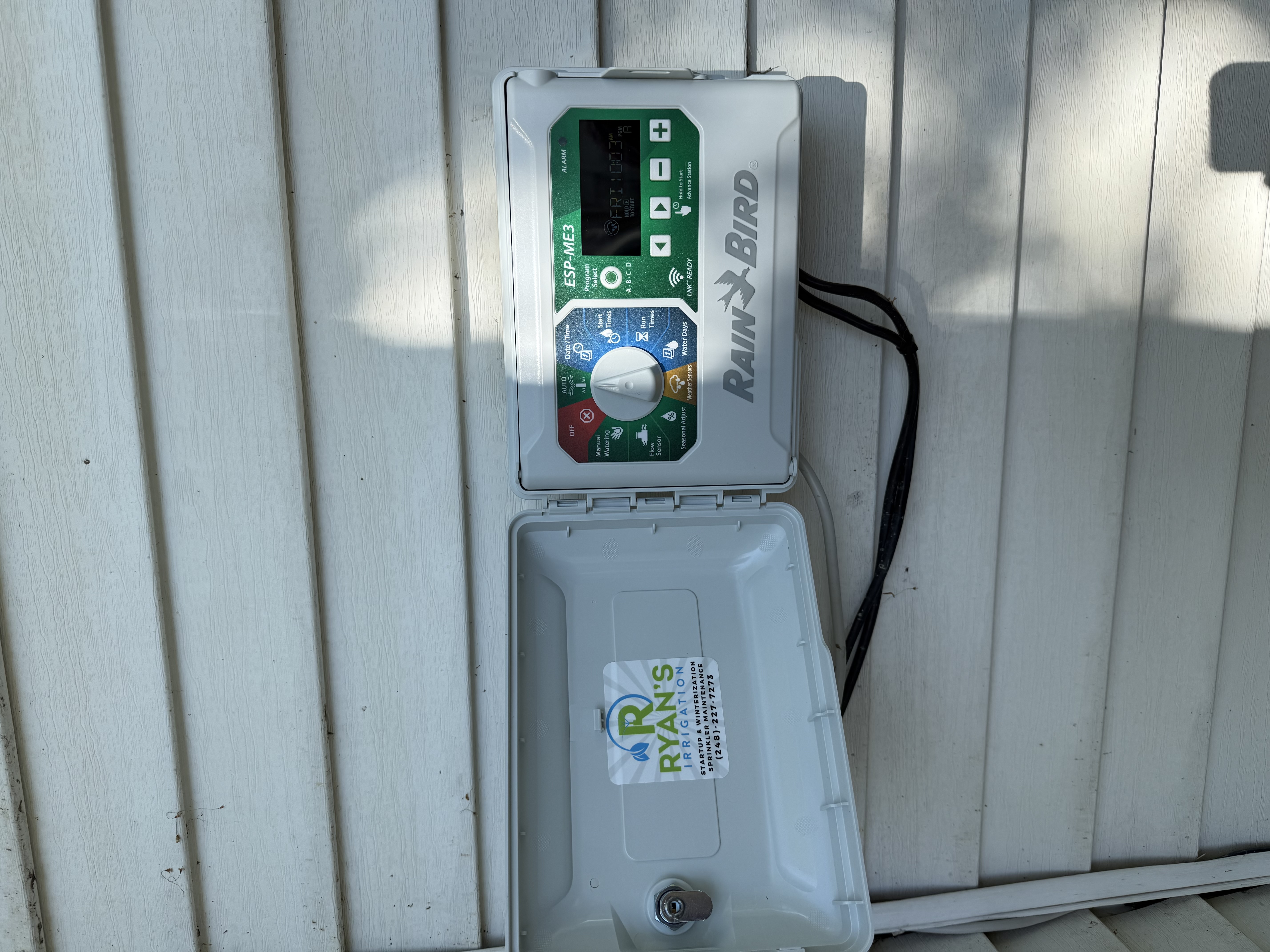 Rain Bird timer and control panel with Ryan's Irrigation branding